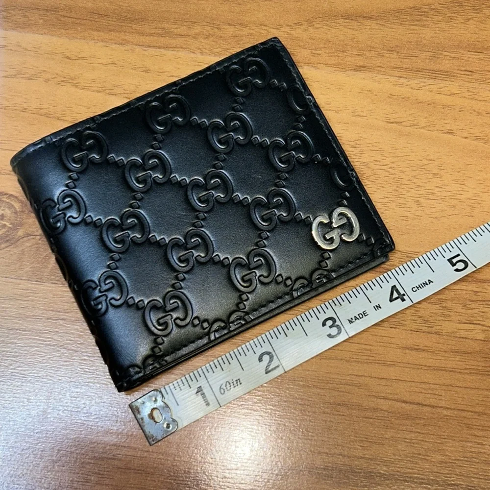 Authentic Gucci Dorian Signature Embossed Leather Bifold Wallet